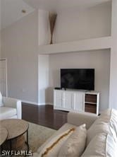 living room featuring vaulted ceiling