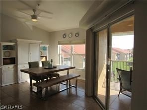 dining space with ceiling fan and vaulted ceiling