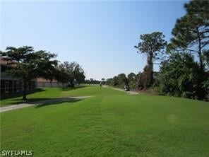 surrounding community featuring a lawn