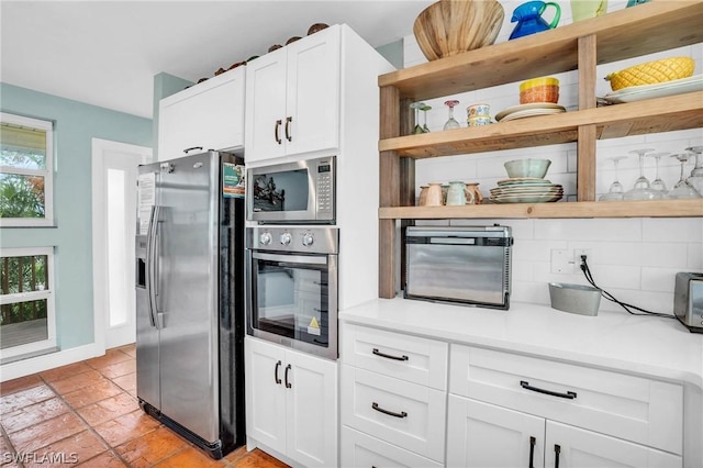 kitchen featuring open shelves, light countertops, appliances with stainless steel finishes, and white cabinetry
