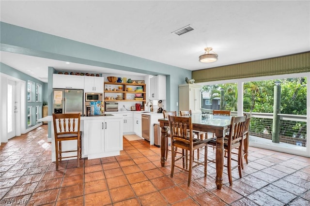 dining room with visible vents