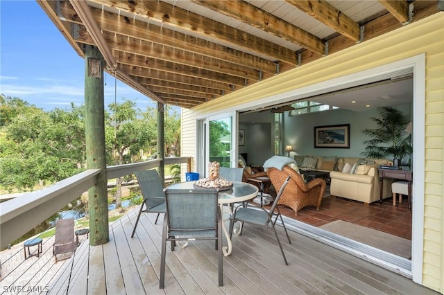 wooden deck with outdoor dining space