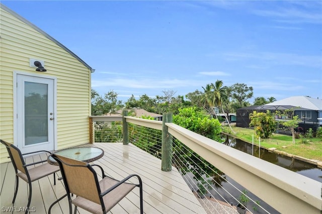 deck featuring a water view