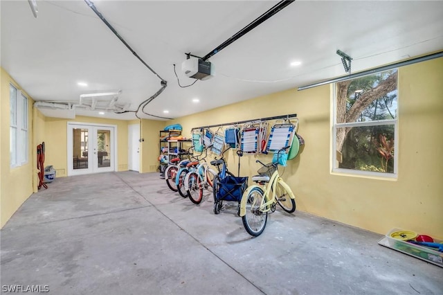 garage with recessed lighting, french doors, and a garage door opener