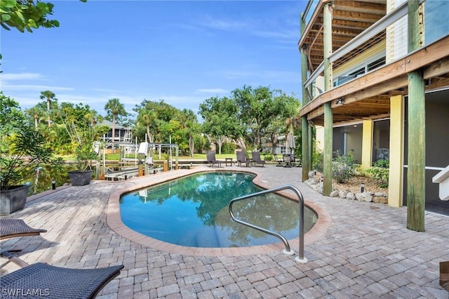 view of swimming pool featuring a patio area