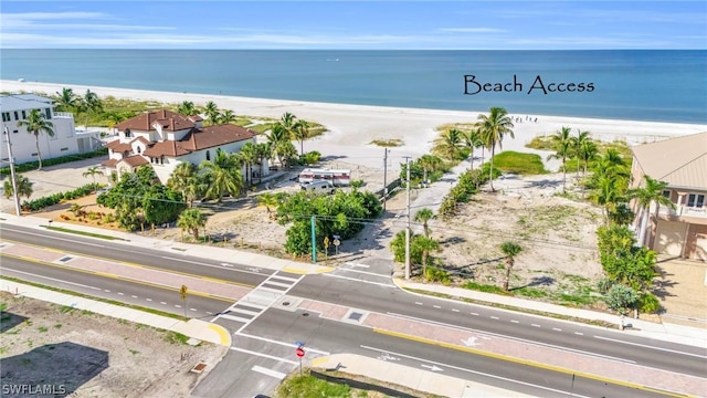 aerial view featuring a water view and a view of the beach