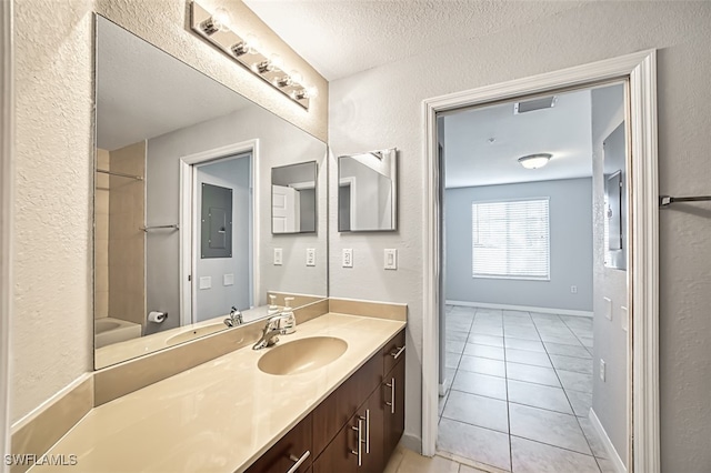 full bathroom featuring visible vents, a textured ceiling, vanity, electric panel, and tile patterned floors