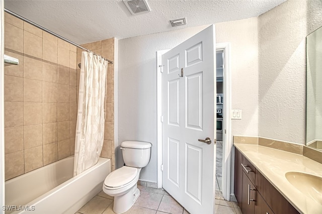 bathroom featuring tile patterned flooring, visible vents, a textured ceiling, and shower / bath combo with shower curtain