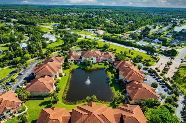 aerial view with a water view and a residential view