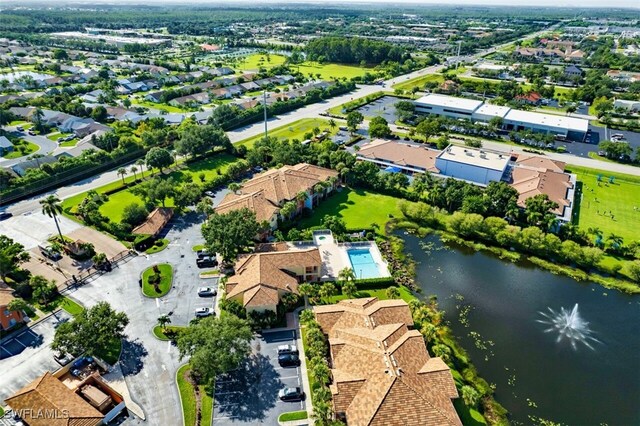 birds eye view of property featuring a water view and a residential view