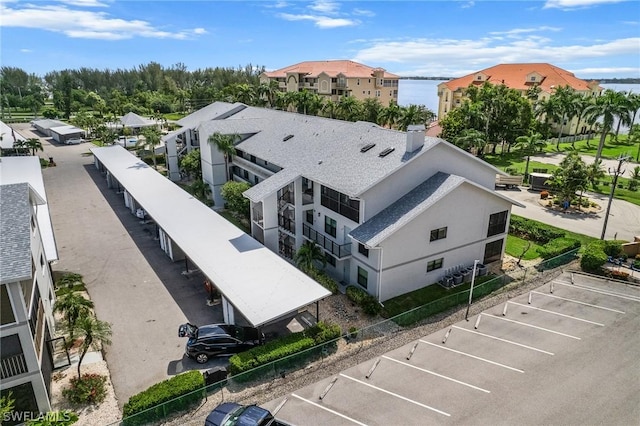 aerial view with a water view and a residential view