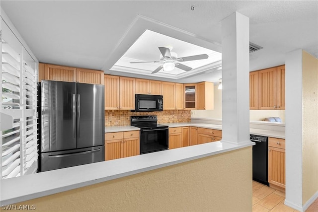 kitchen featuring glass insert cabinets, light countertops, black appliances, and light brown cabinetry