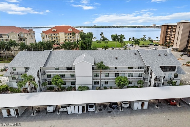 birds eye view of property featuring a water view