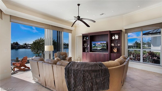 living room with crown molding, ceiling fan, light tile patterned floors, and a water view