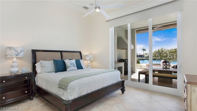 bedroom featuring ceiling fan and a water view