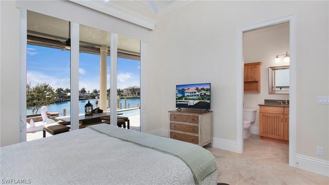 bedroom featuring connected bathroom, access to outside, and ornamental molding