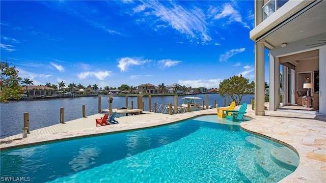 view of pool featuring a boat dock, a water view, and a patio