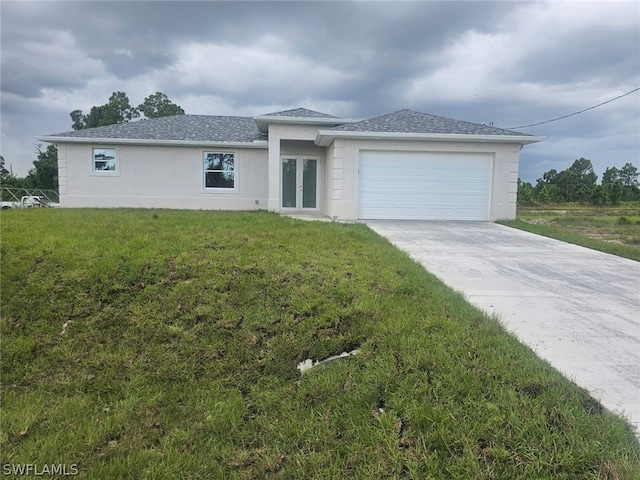 view of front of home featuring a front lawn and a garage