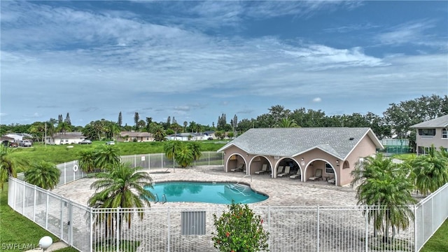 view of swimming pool featuring a patio area