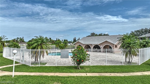 view of pool featuring a yard