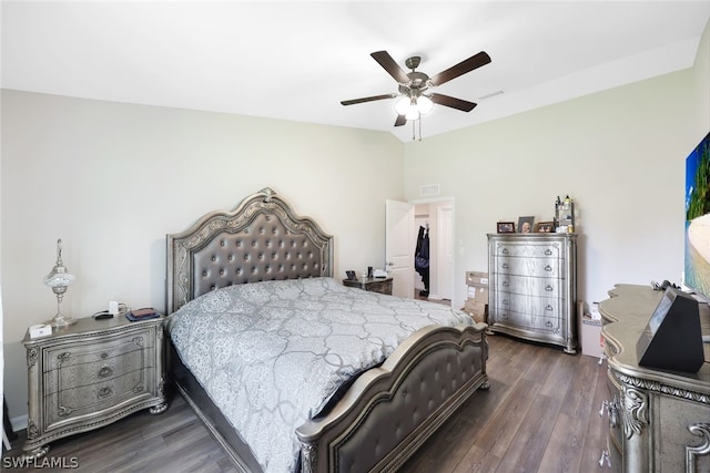 bedroom with dark hardwood / wood-style floors and ceiling fan