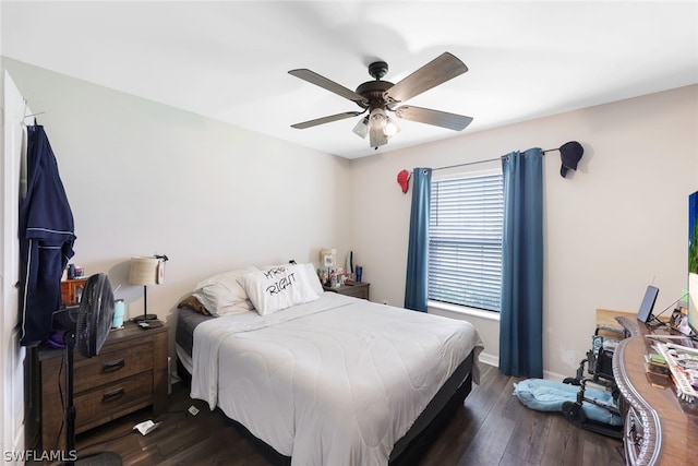 bedroom with ceiling fan and dark hardwood / wood-style flooring