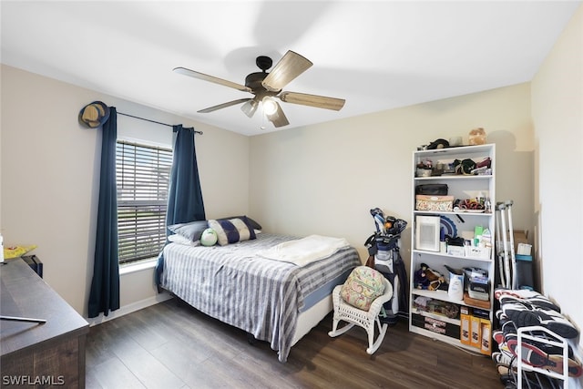 bedroom featuring ceiling fan and dark hardwood / wood-style floors