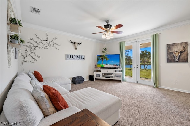 carpeted living room featuring ceiling fan, ornamental molding, and french doors