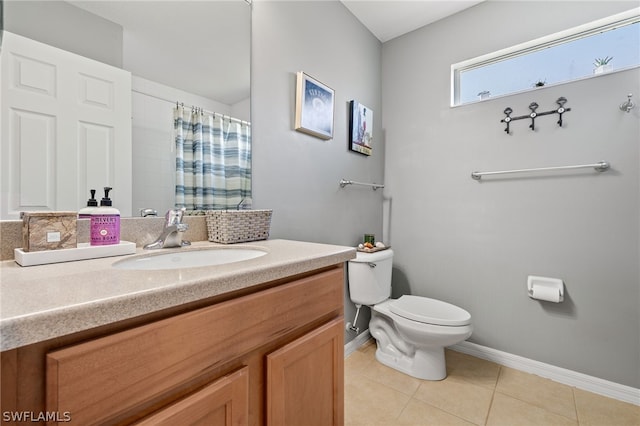 bathroom featuring vanity, curtained shower, tile patterned floors, and toilet