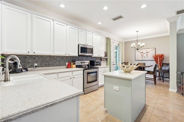 kitchen featuring stainless steel appliances, light tile patterned floors, and decorative backsplash