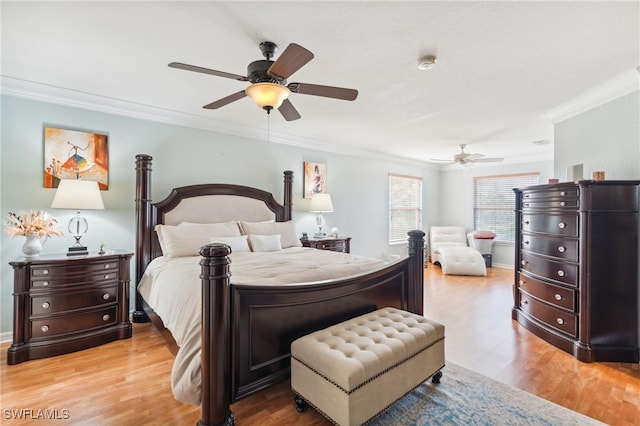 bedroom with crown molding, ceiling fan, and hardwood / wood-style flooring