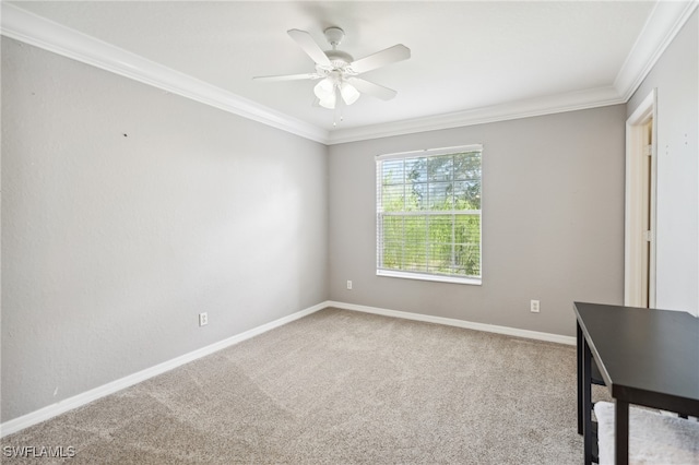 empty room with ornamental molding, carpet flooring, and ceiling fan