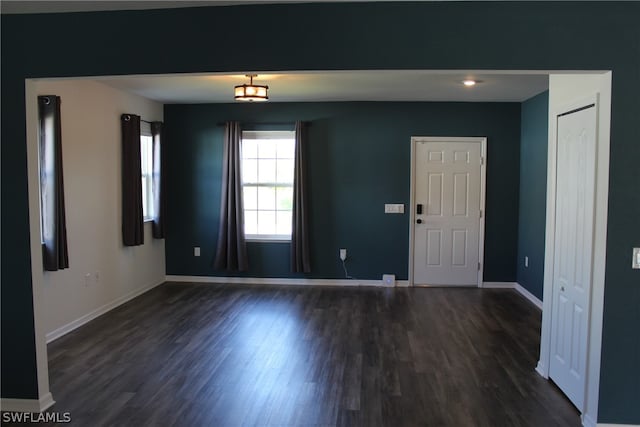 spare room featuring dark hardwood / wood-style flooring