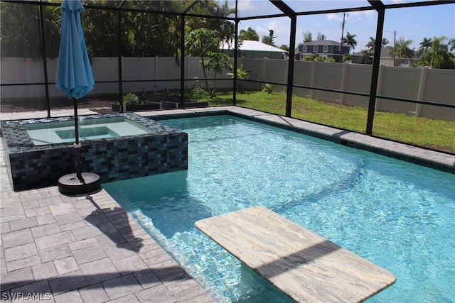 view of pool featuring an in ground hot tub and glass enclosure