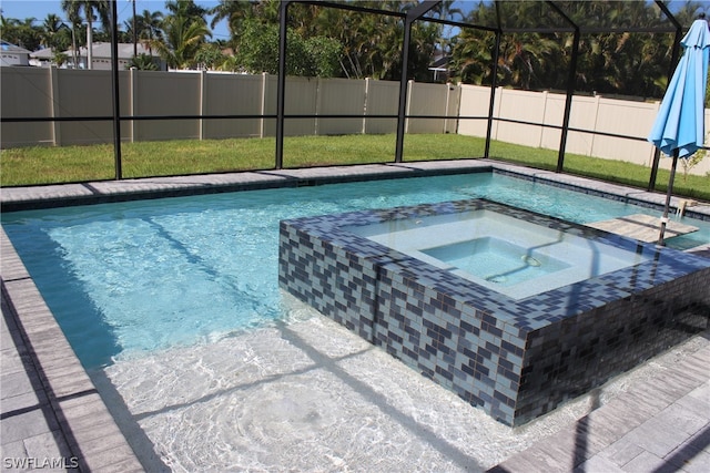 view of swimming pool with an in ground hot tub