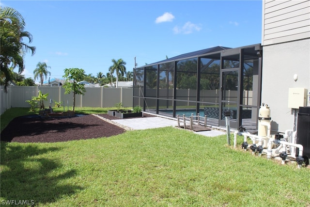 view of yard featuring a fenced in pool and a lanai