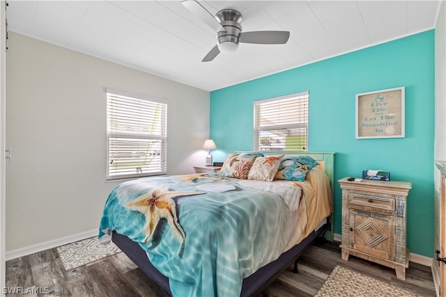 bedroom featuring dark wood-type flooring and ceiling fan