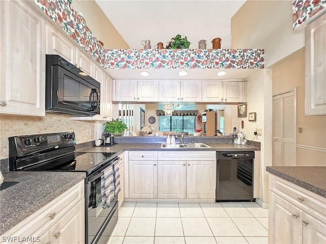 kitchen featuring backsplash, black appliances, sink, and light tile patterned floors