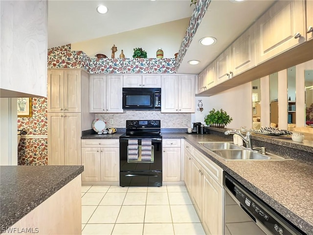 kitchen featuring sink, vaulted ceiling, light tile patterned floors, decorative backsplash, and black appliances