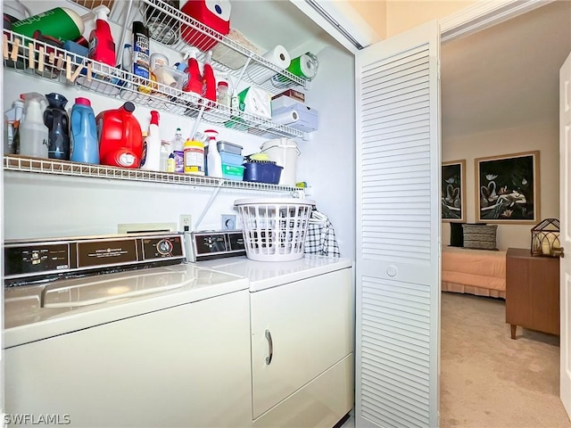 laundry room featuring light colored carpet and washing machine and clothes dryer