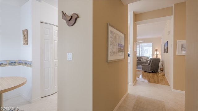 hallway featuring light tile patterned floors