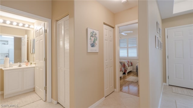 hallway with light tile patterned floors