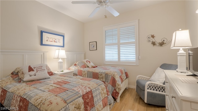 bedroom with light wood-type flooring and ceiling fan