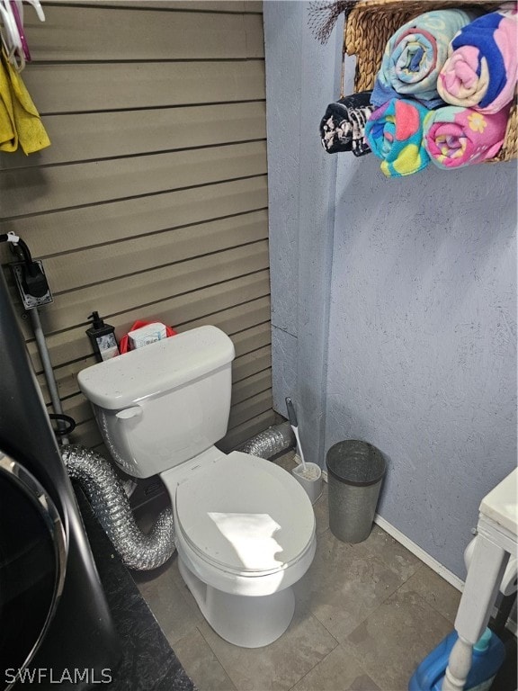 bathroom with tile patterned floors and toilet