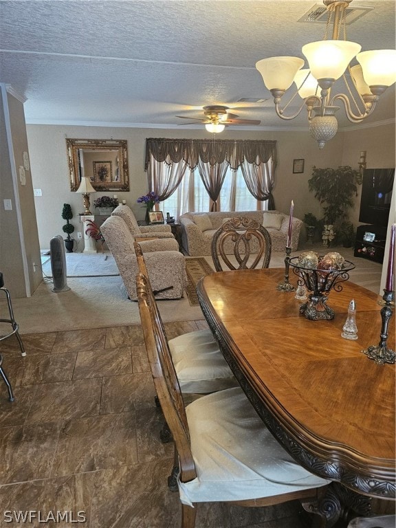 tiled dining area featuring a textured ceiling, crown molding, and ceiling fan with notable chandelier