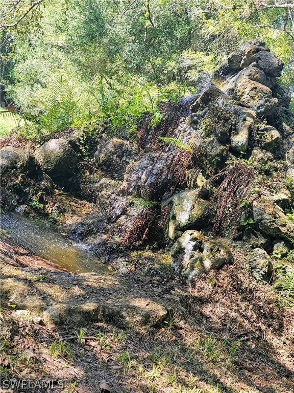 view of landscape featuring a water view