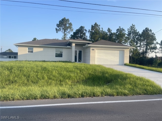 view of front of house featuring a garage and concrete driveway