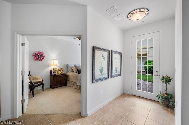 foyer with light carpet