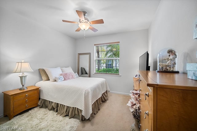 bedroom with light colored carpet and ceiling fan