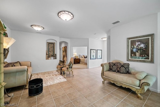 sitting room with light tile patterned floors